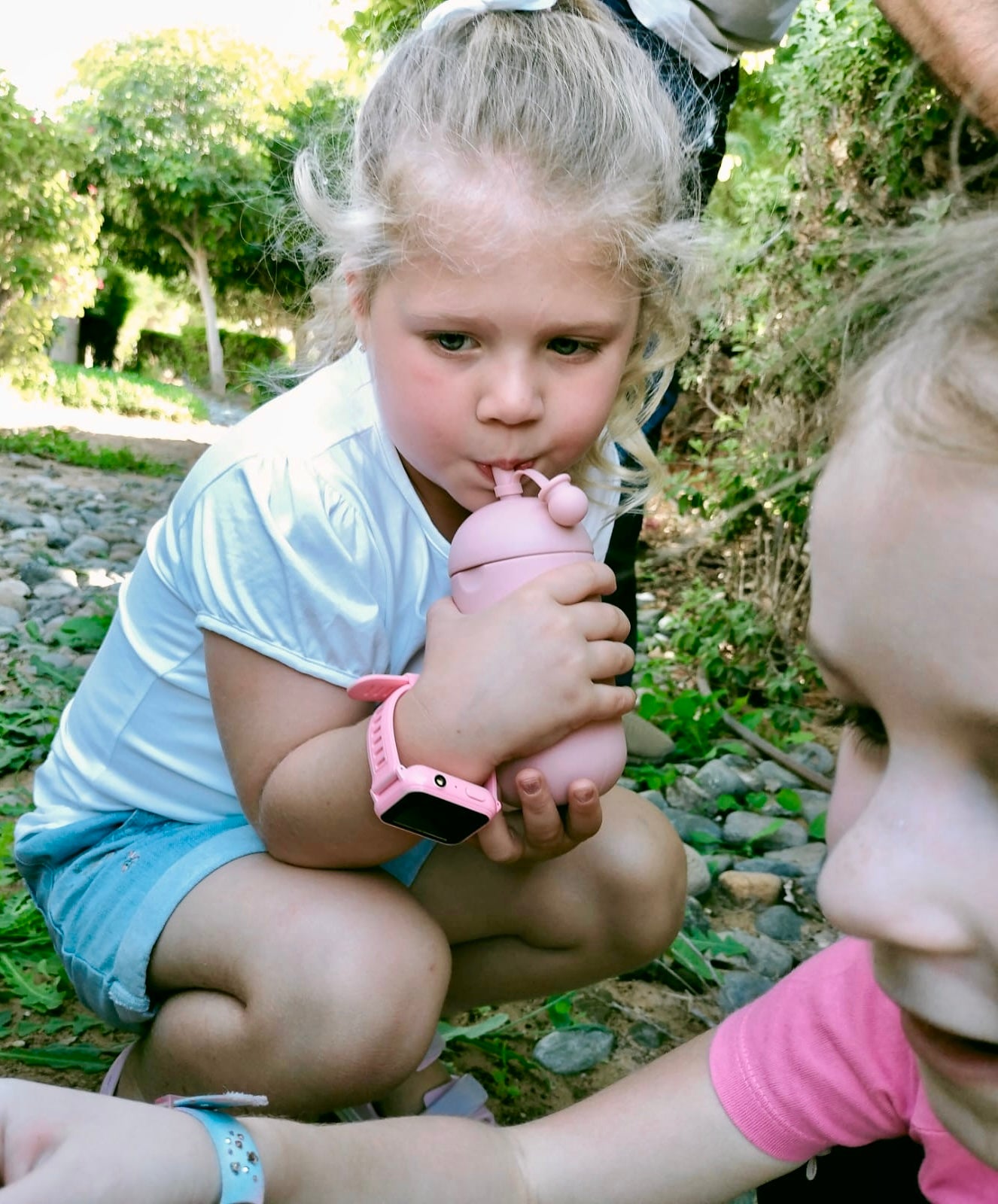 Little girl with silicone water bottle